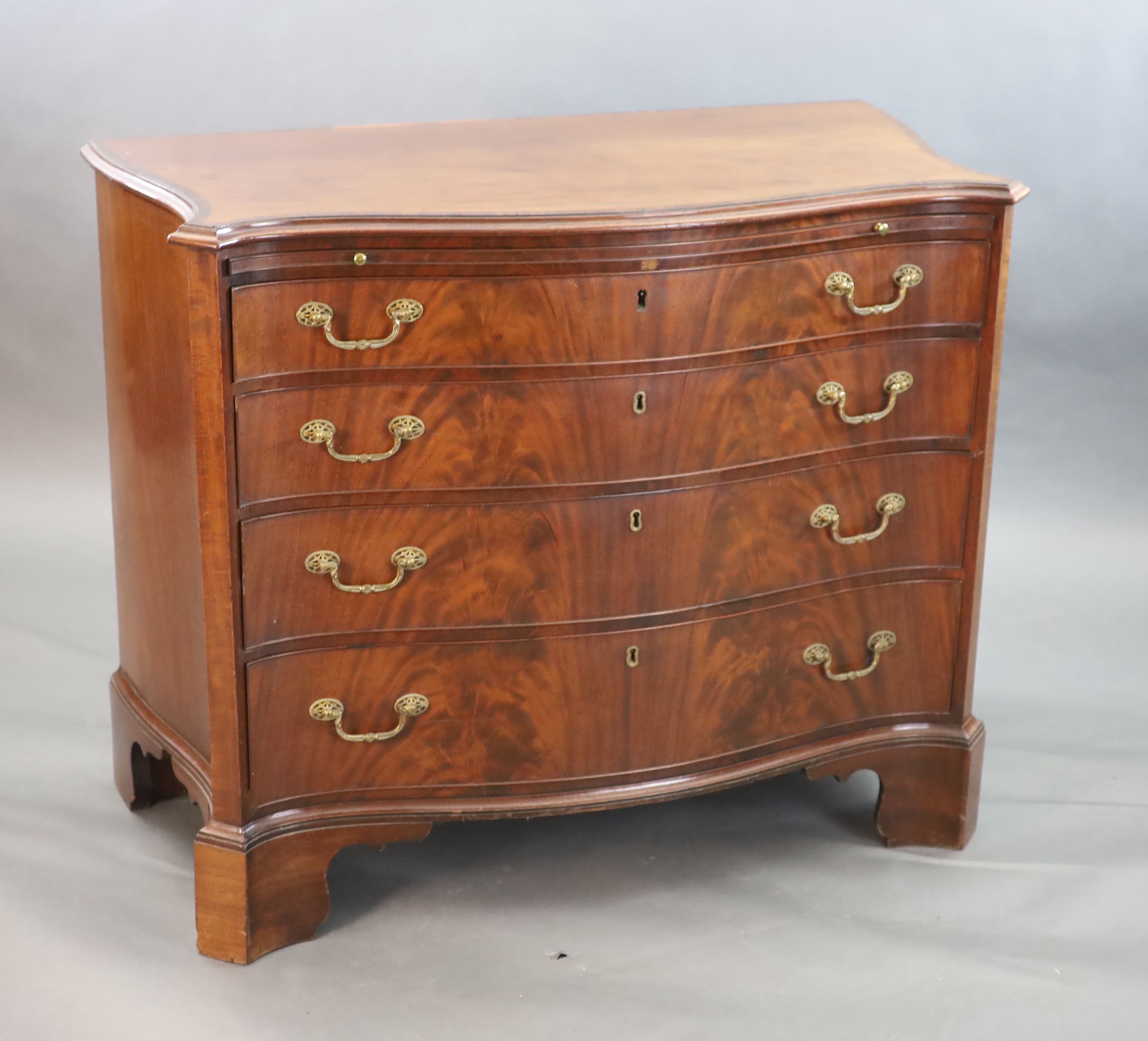 A George III mahogany and rosewood banded serpentine fronted chest, W. 3ft 7in. D. 1ft 10in. H. 2ft 11in.